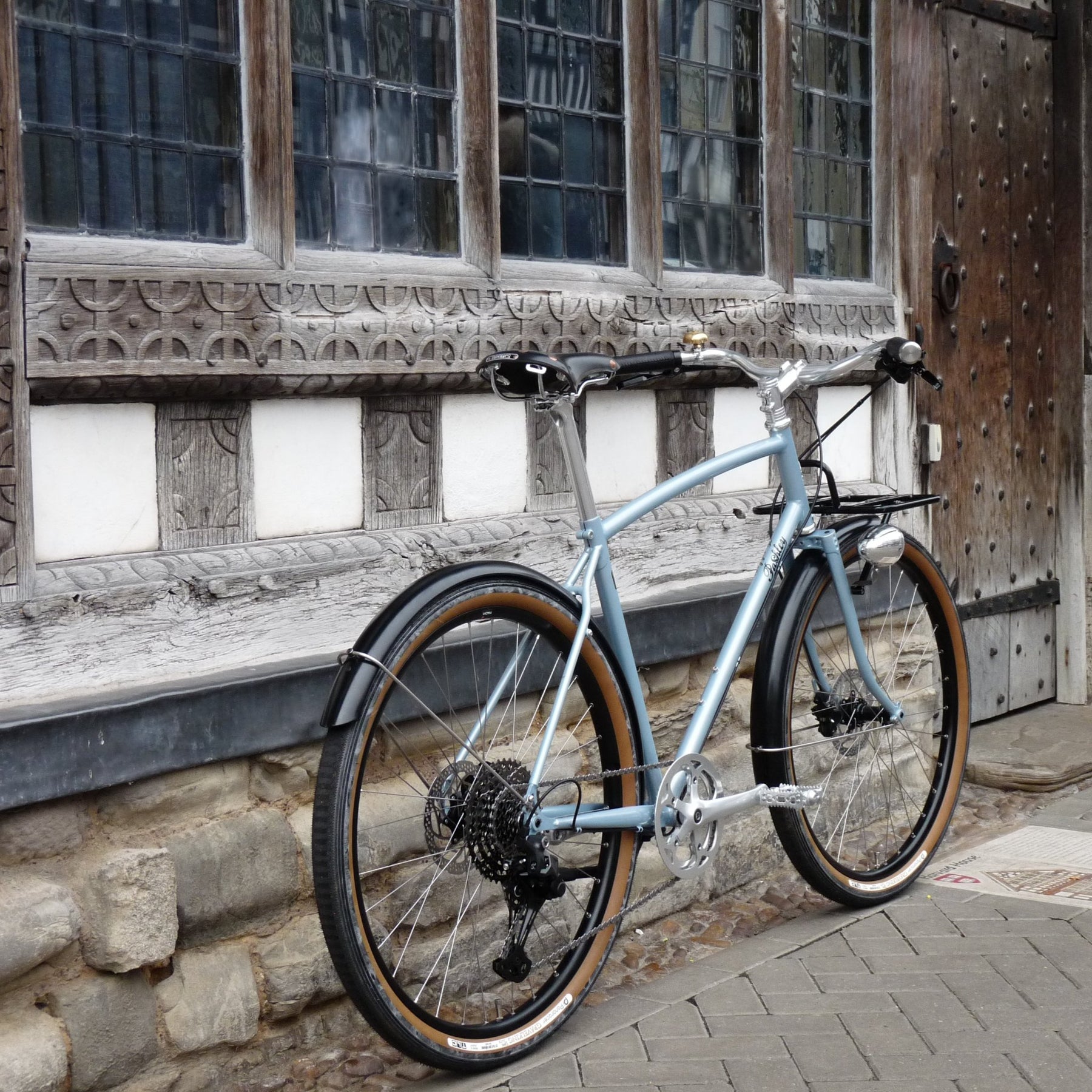 a Blue equipped Prospero bicycle with black mudguards