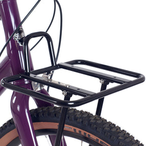 Close-up of black front Pashley Porteur rack on purple pathfinder bike.