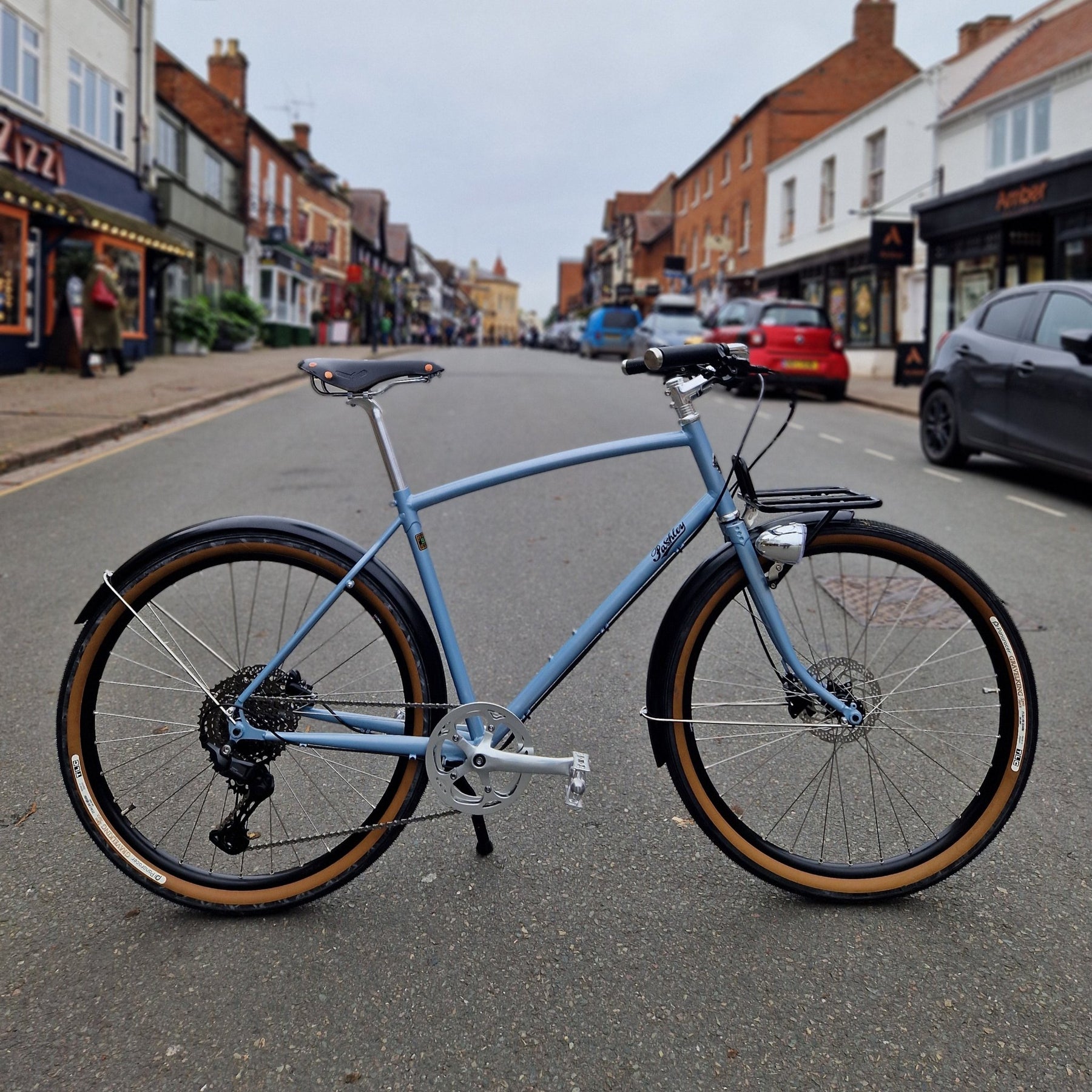 A blue Prospero equipped bicycle in the street